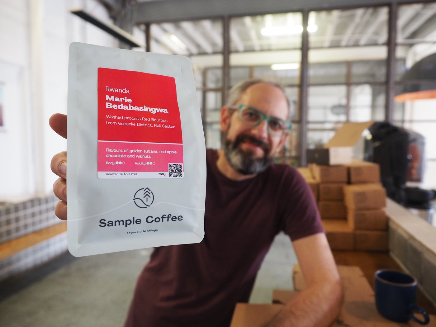 Simon with a bag of Marie's coffee