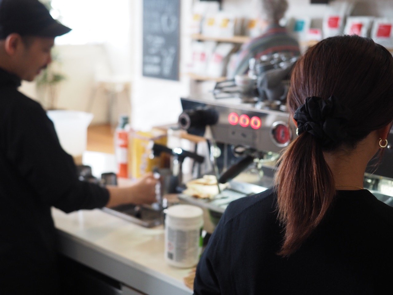 A photo of Sample Coffee staff working in the espresso machine