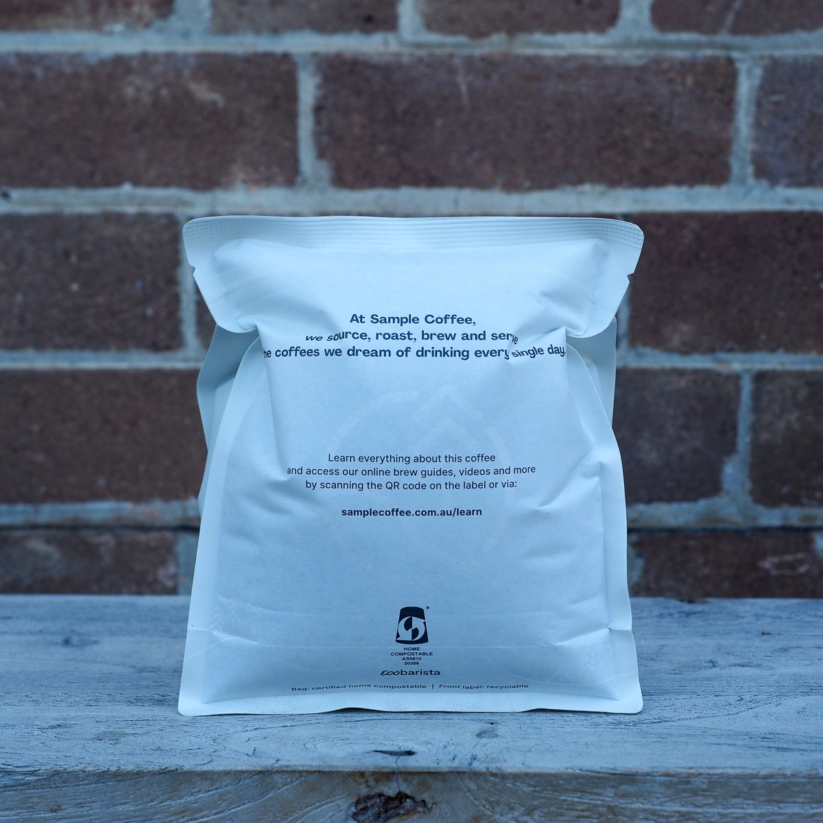 A side view of a Sample Coffee 250g bean bag, puffed up like a balloon.