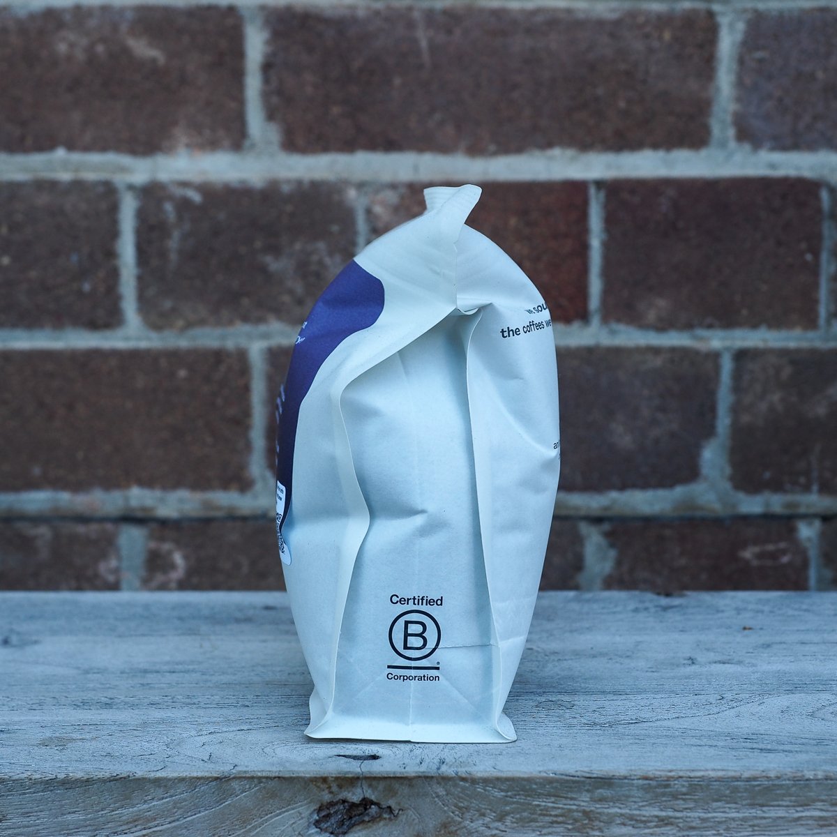 A rear view of a Sample Coffee 250g bean bag, puffed up like a balloon.