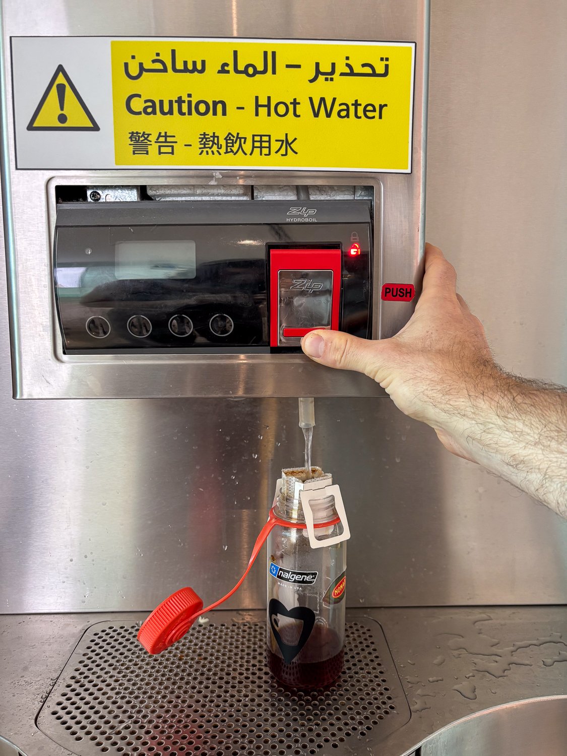 Brewing a drip coffee bag in a major airport