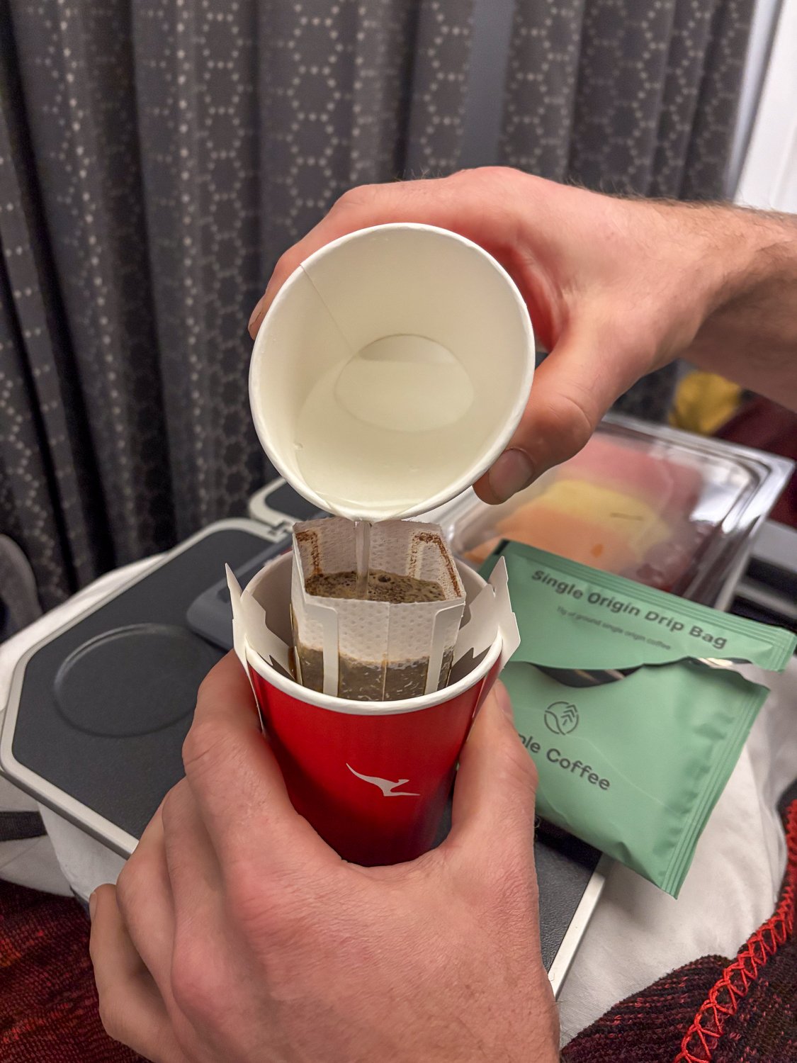 Brewing a drip or pour over coffee bag in an airplane