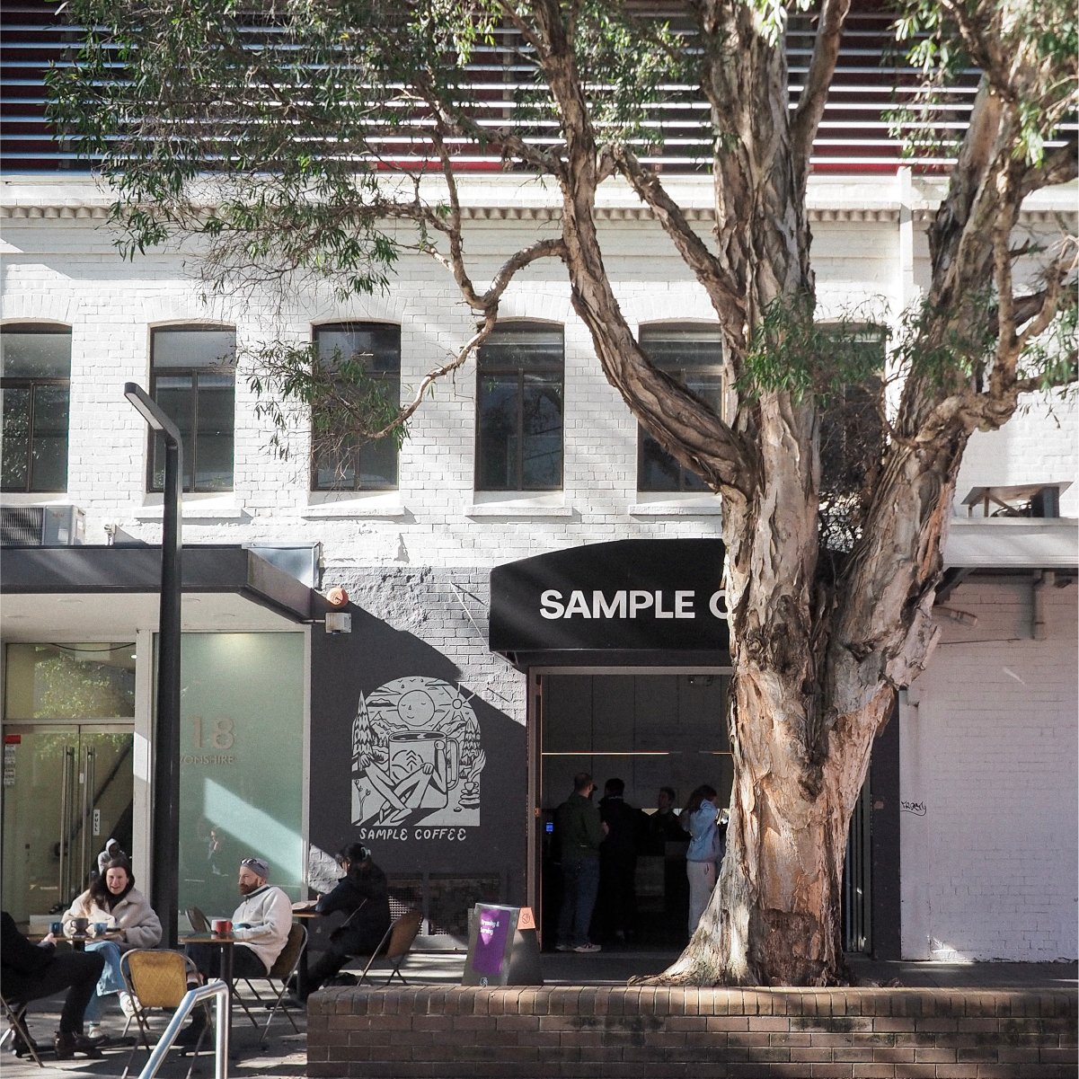 An outdoor shot of Sample Coffee Surry Hills