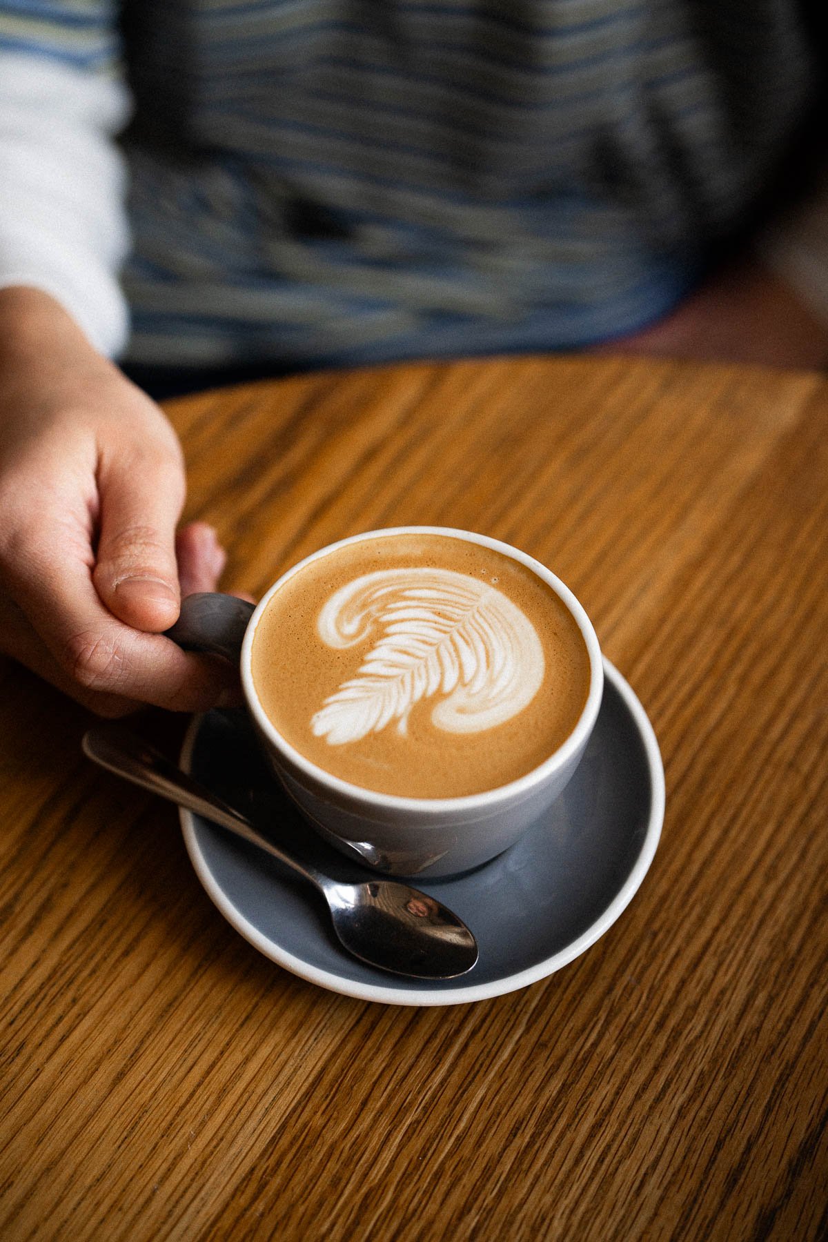 A nice coffee cup with latte art.