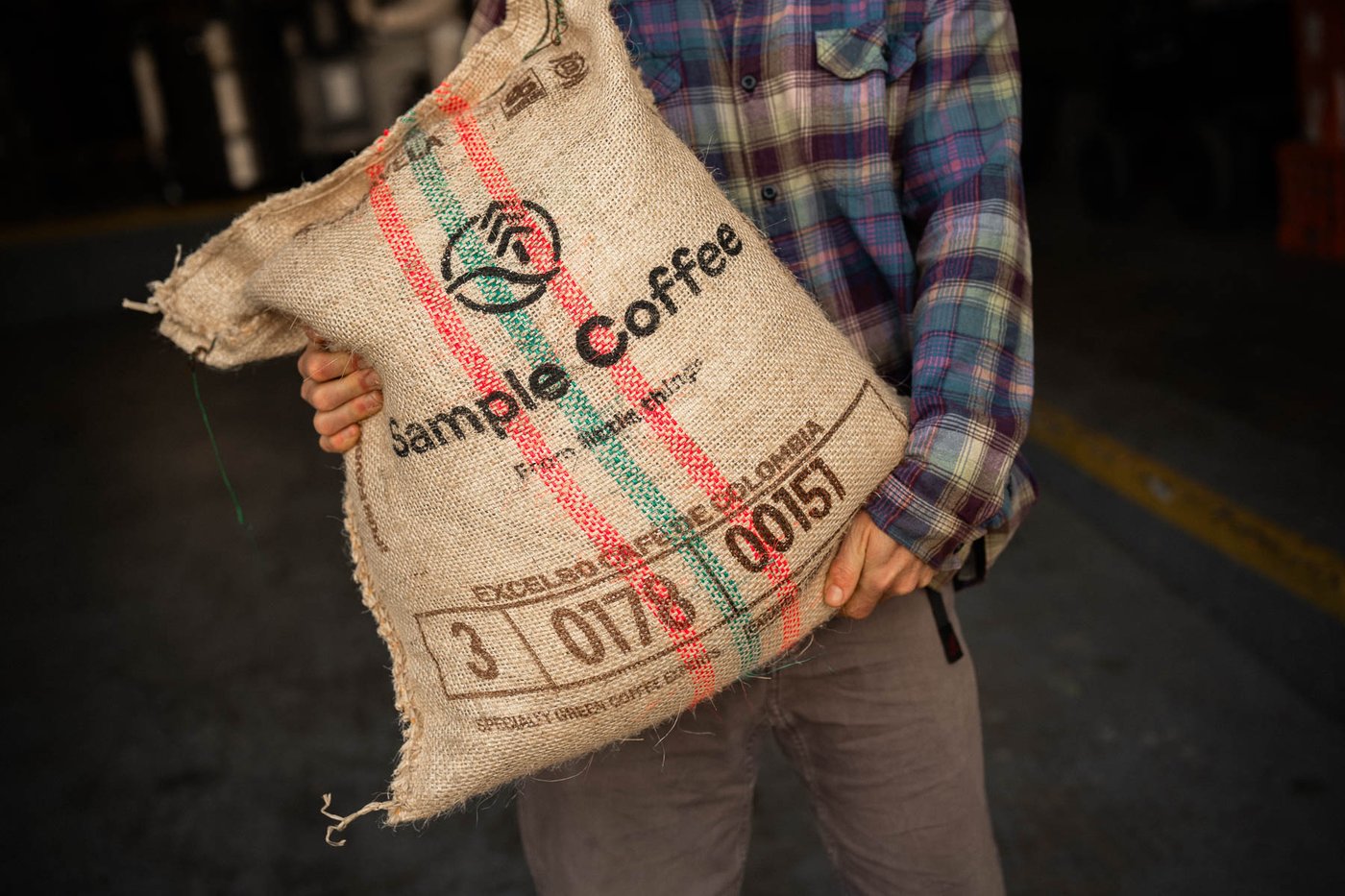 A hessian sack of green coffee, Sample Coffee branded.
