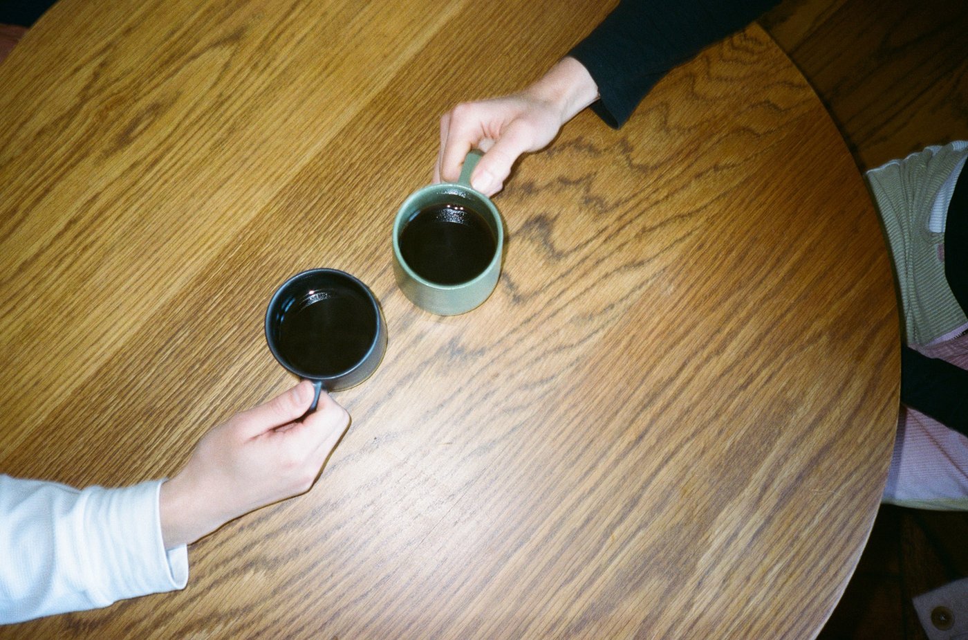 Sharing a filter coffee in a table.