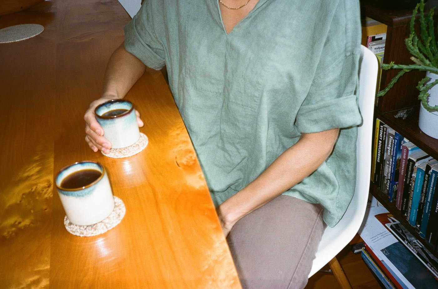 Sharing 2 cups filter coffee in a home dining table.