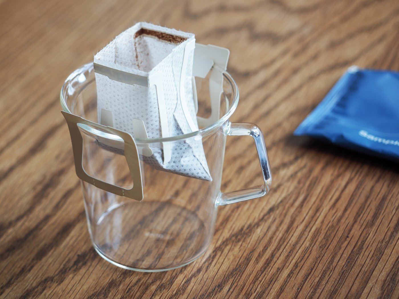 A drip bag in place, in a transparent cup.