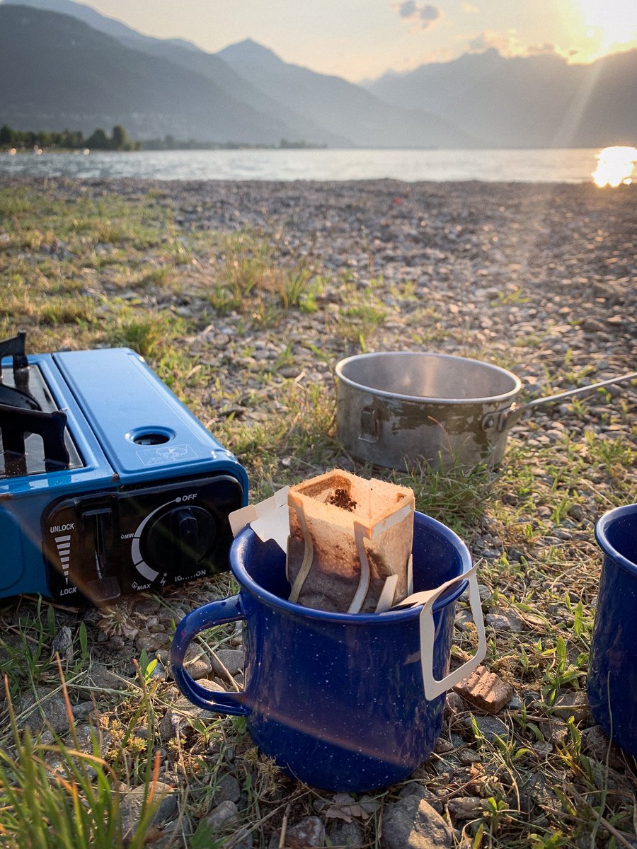 Brewing a drip bag on the shore of Lake Como, Italy.