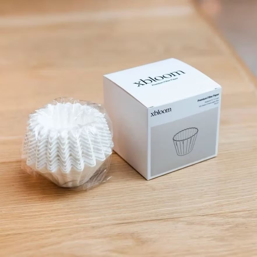 The xBloom paper filters next to the box