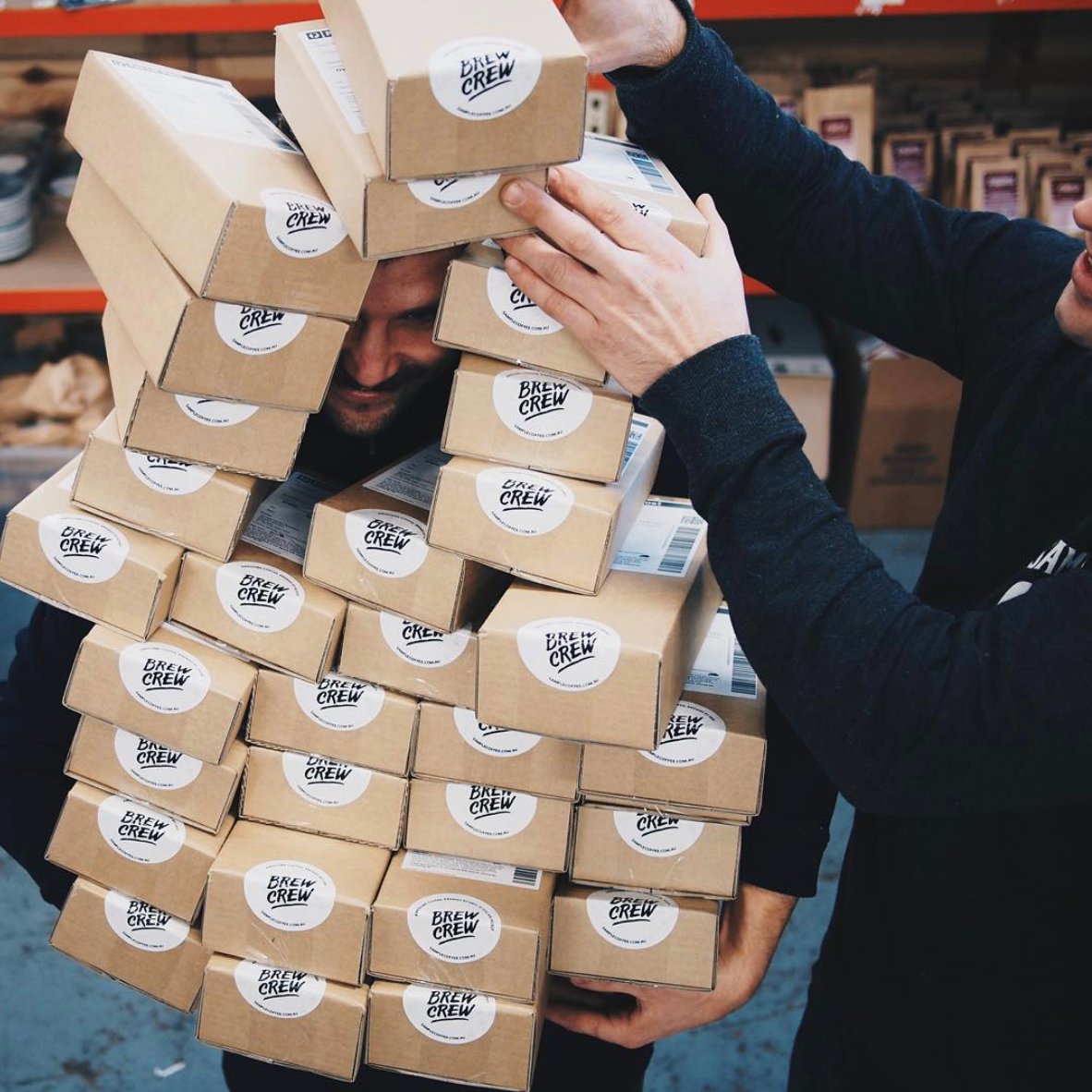 John full of coffee delivery boxes in our warehouse
